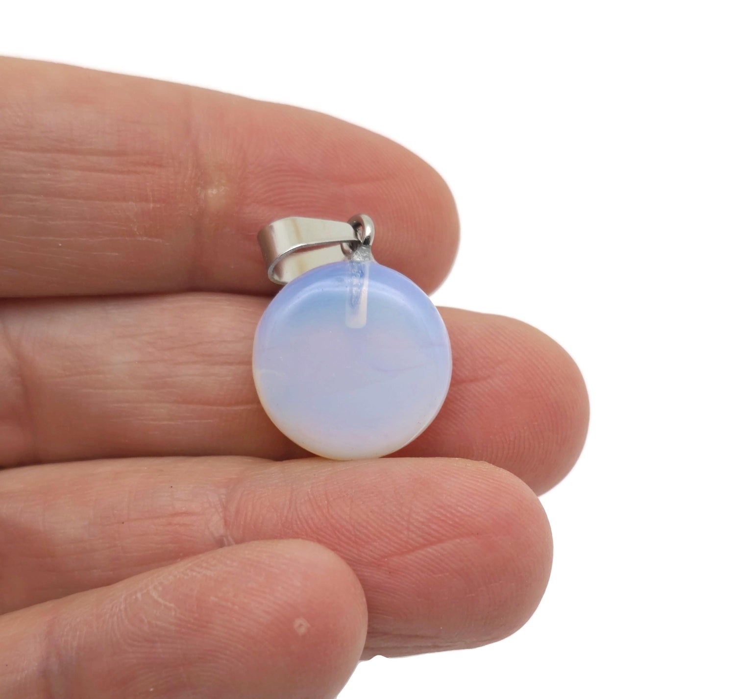 Opalite flat round gemstone pendant with crystal coin design from GemstoneGO, showcasing a smooth, luminous oval-shaped gemstone.