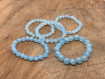 Aquamarine beaded crystal bracelet by GemstoneGO, stretchy unisex accessory featuring blue gemstones and crystal healing properties.