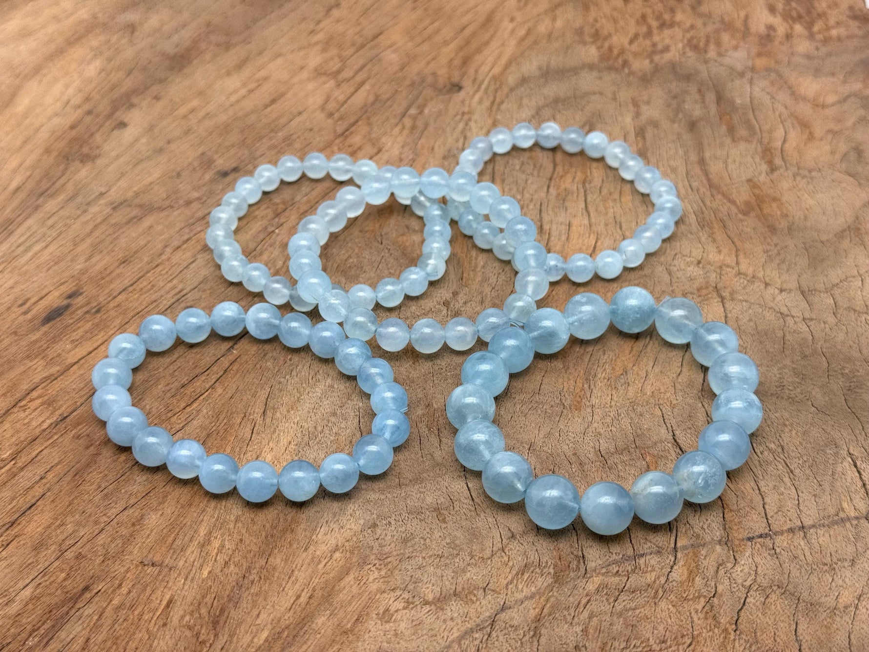 Aquamarine beaded crystal bracelet by GemstoneGO, stretchy unisex accessory featuring blue gemstones and crystal healing properties.