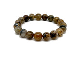 Golden rutilated quartz beaded crystal bracelet for men and women, featuring stretchy design and gemstone healing properties.