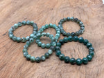 Beaded crystal bracelet for men and women featuring green chlorite stones, stretch design, ideal for crystal healing by GemstoneGO.