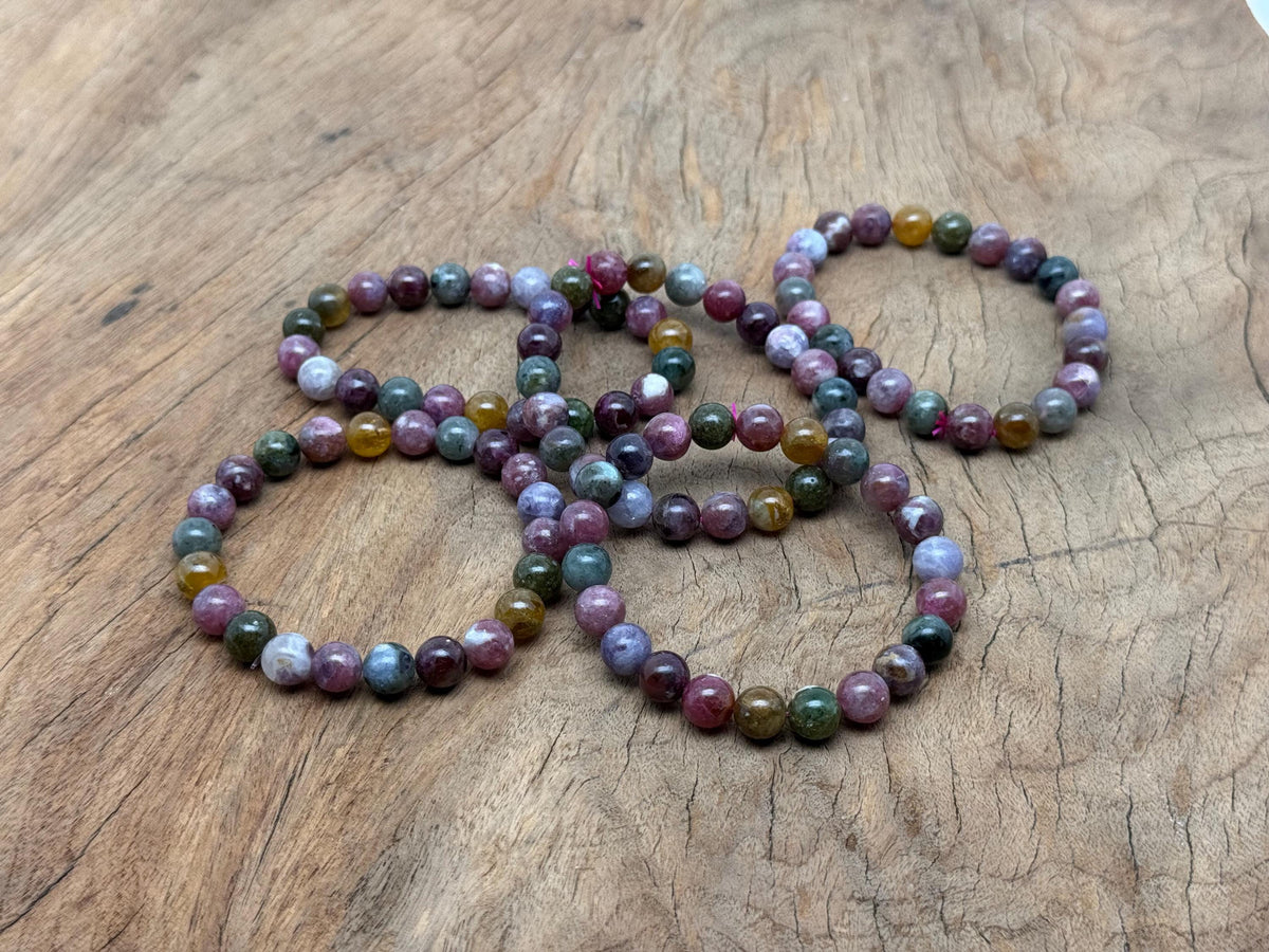 Rainbow tourmaline beaded crystal bracelet with stretchy band, suitable for men and women, featuring vibrant multicolor gemstones.