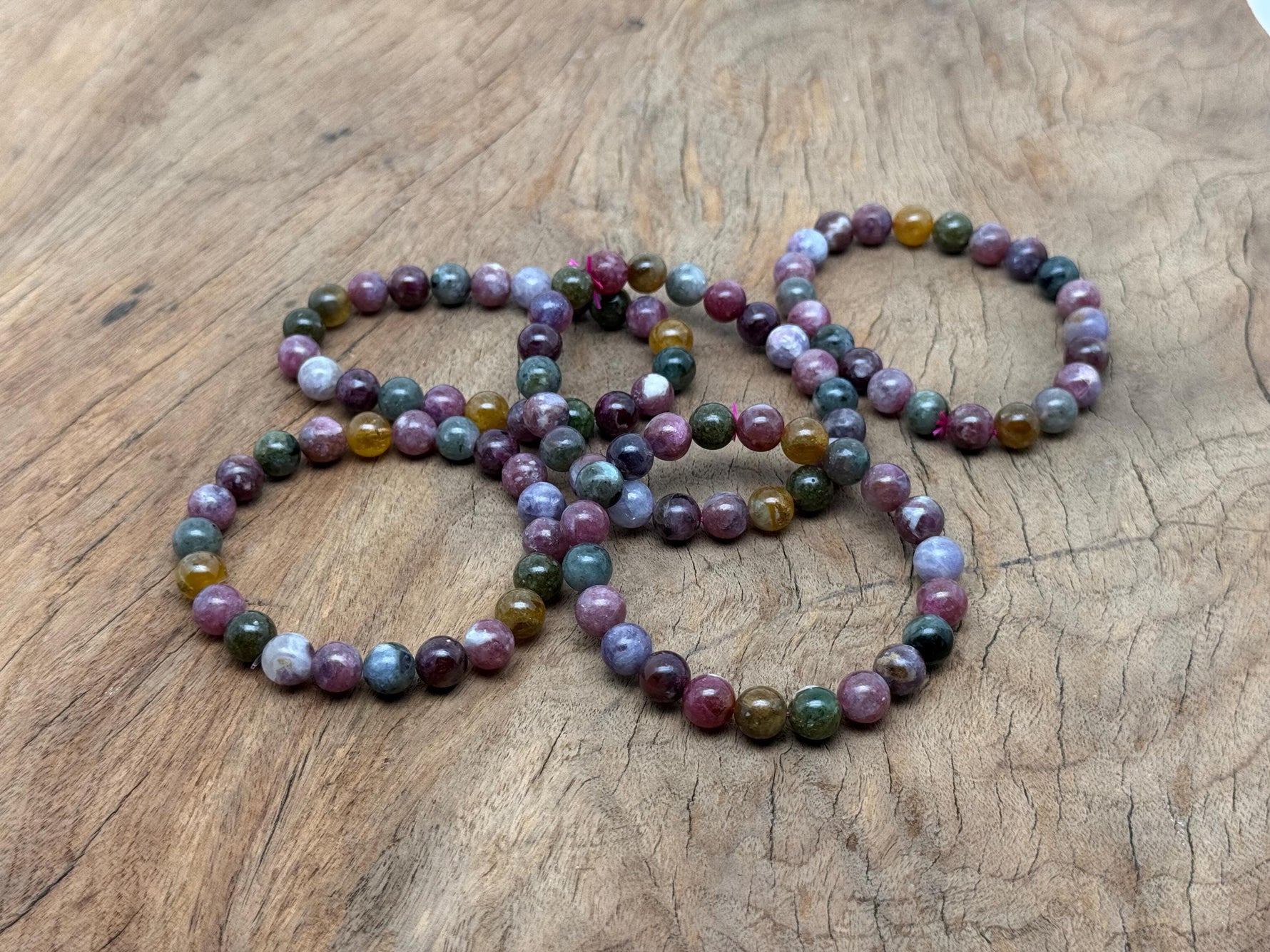Rainbow tourmaline beaded crystal bracelet with stretchy band, suitable for men and women, featuring vibrant multicolor gemstones.