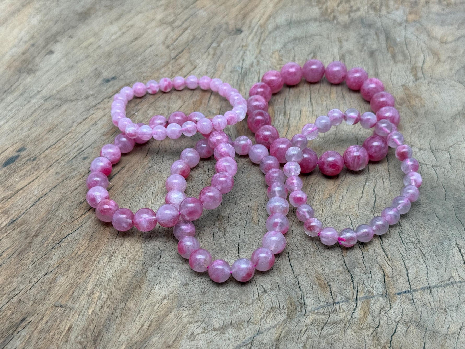 Watermelon Quartz beaded crystal bracelet for men and women, featuring stretchy design and healing properties.