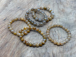 Yellow sapphire beaded crystal bracelet for men and women, stretchy stretch bracelet with crystal healing properties.