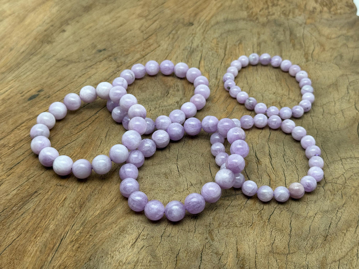 Kunzite beaded crystal stretch bracelet for men and women, featuring polished gemstones for healing and stylish wear.