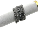 Tourmalinated Quartz beaded crystal bracelet for men and women, featuring black and clear stone beads on a stretchy band.
