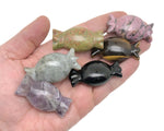 Colorful candy-shaped crystal carvings from GemstoneGO, used as healing metaphysical decor and gift, featuring sweet, vibrant designs.