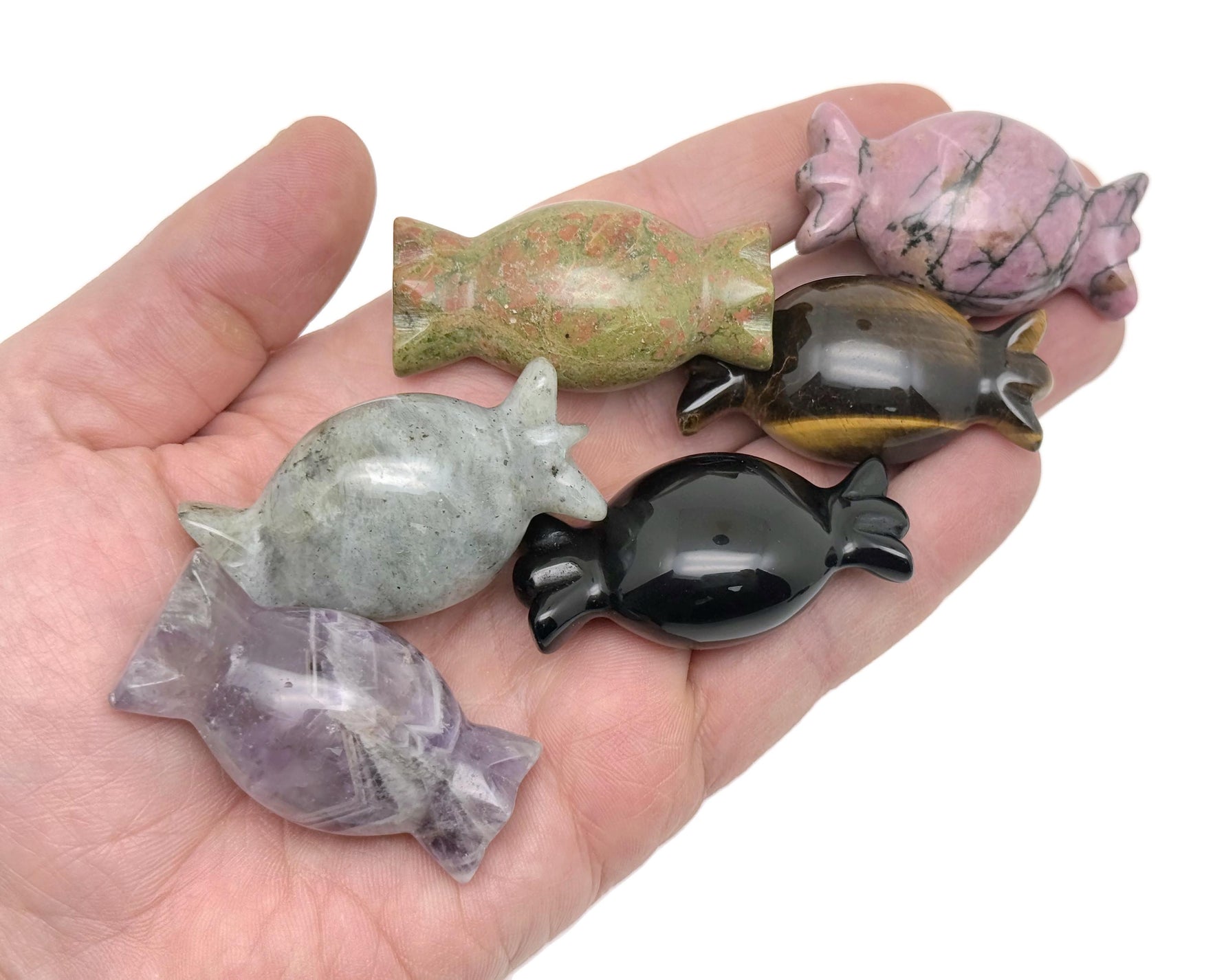 Colorful candy-shaped crystal carvings from GemstoneGO, used as healing metaphysical decor and gift, featuring sweet, vibrant designs.