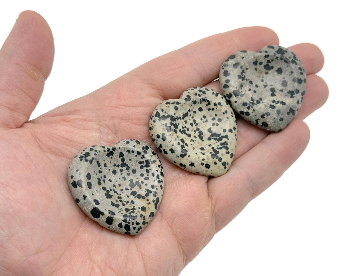 Natural crystal worry stone from GemstoneGO, soothing heart chakra crystal for stress relief and relaxation, travel-friendly healing stone.