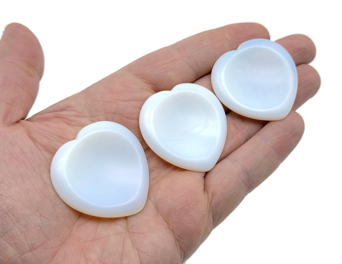 Natural crystal worry stone from GemstoneGO, soothing heart chakra crystal for stress relief and relaxation, ideal for travel.