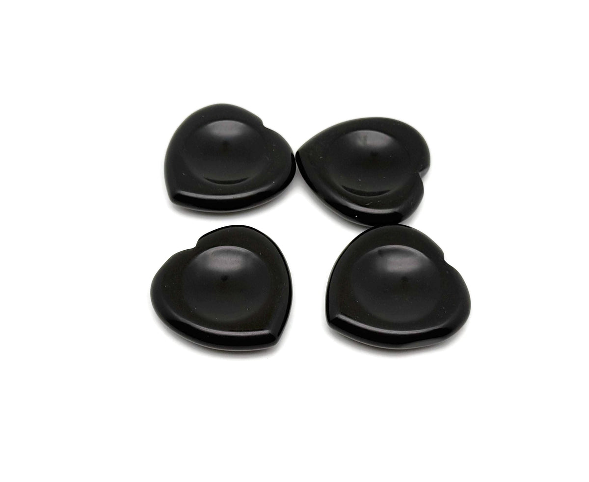 Polished black obsidian heart worry stone from GemstoneGO, smooth soothing crystal for stress relief and meditation.