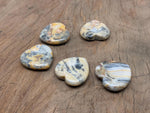 Crazy Lace Agate heart worry stone from GemstoneGO, featuring vibrant banded patterns and a smooth polished surface.