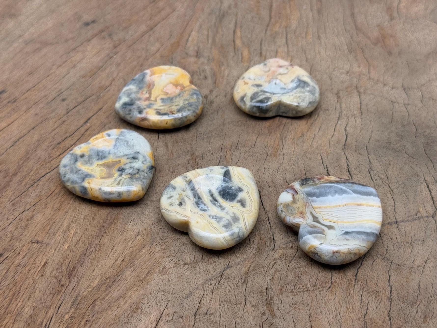 Crazy Lace Agate heart worry stone from GemstoneGO, featuring vibrant banded patterns and a smooth polished surface.