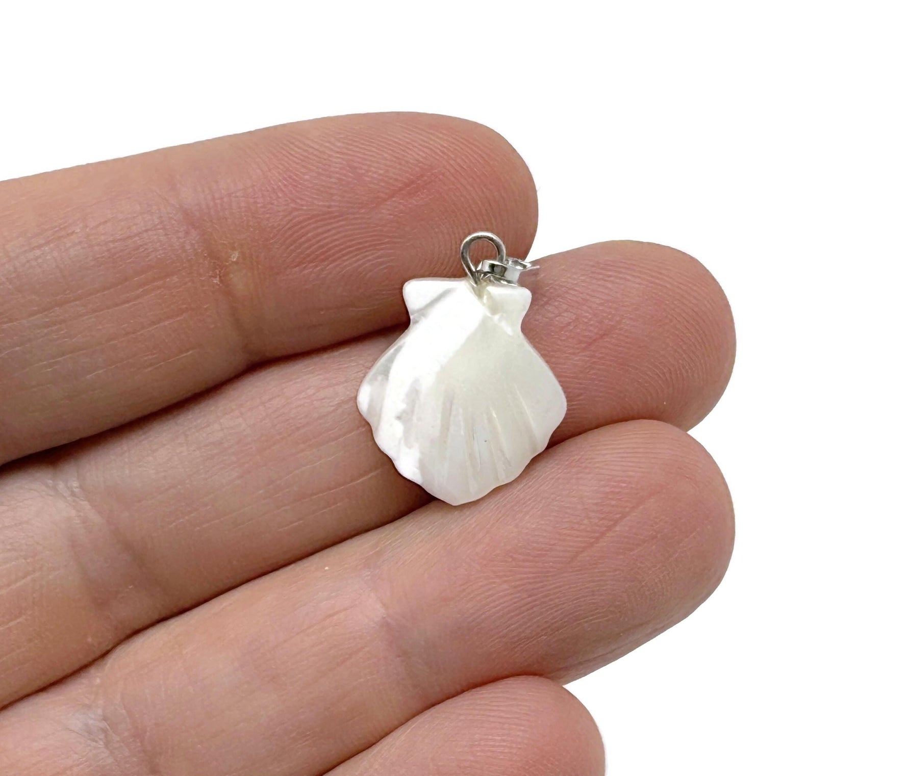Natural pearl shell pendant featuring a sea shell design with gemstone accents, crafted by GemstoneGO.
