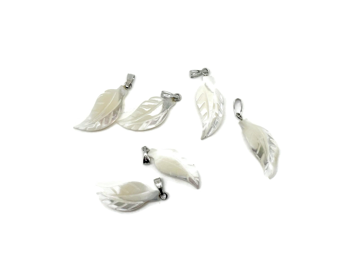 Natural pearl leaf and sea shell gemstone pendant from GemstoneGO, showcasing intricate design and vibrant gemstone details.