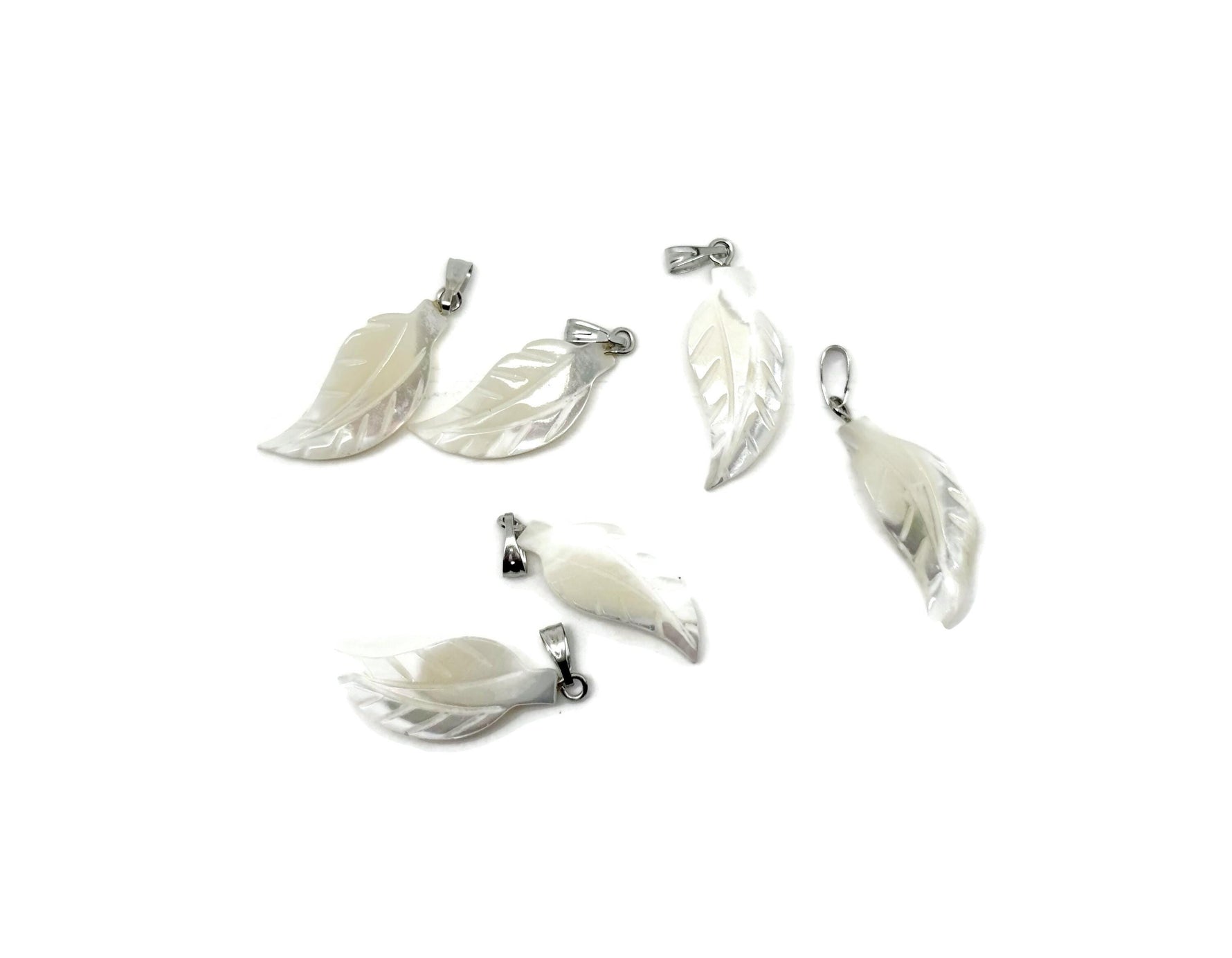 Natural pearl leaf and sea shell gemstone pendant from GemstoneGO, showcasing intricate design and vibrant gemstone details.