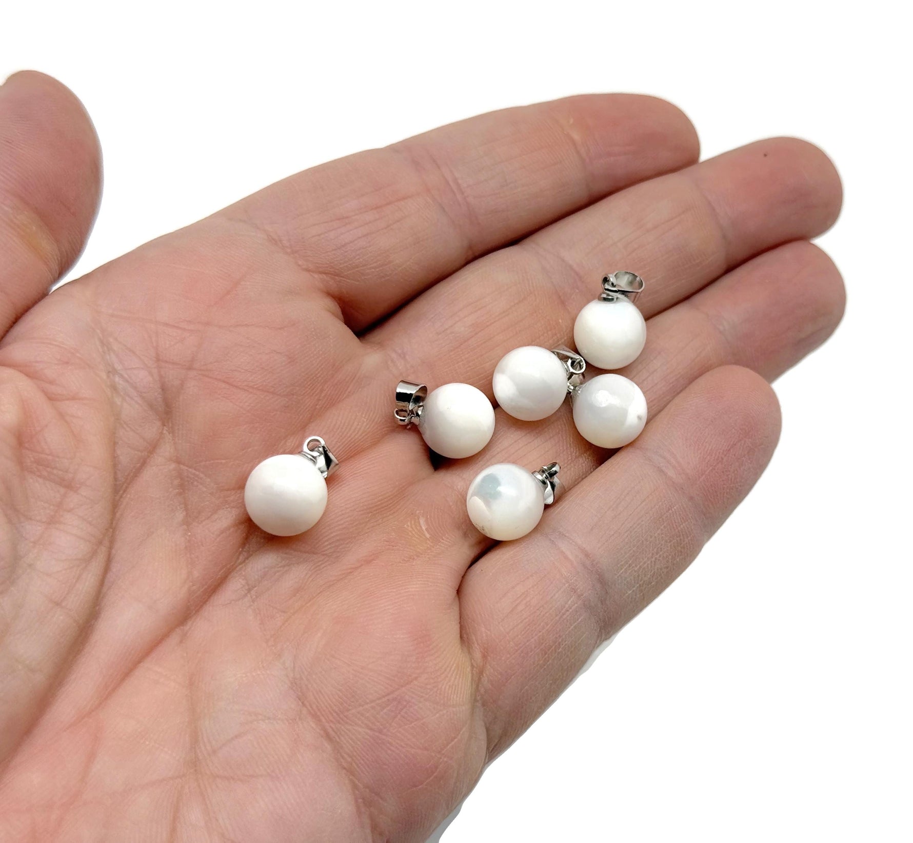 Natural pearl and sea shell gemstone pendant with a ball design from GemstoneGO, showcasing a delicate, elegant jewelry piece.