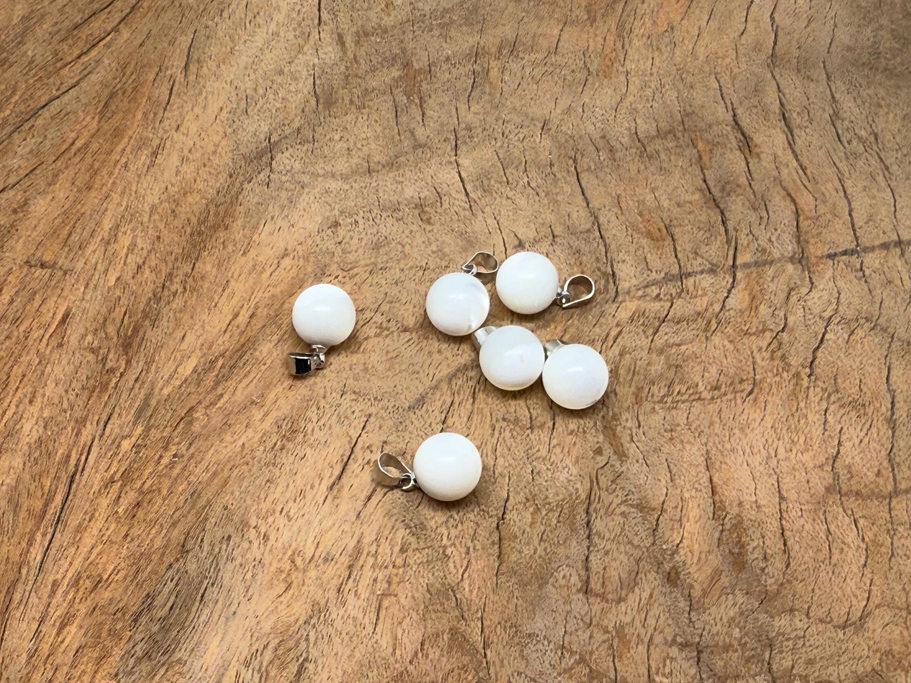 Natural pearl and seashell gemstone pendant from GemstoneGO featuring a spherical pearl ball and shell accents.