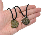 Green Moldavite pendant necklace with a polished gemstone, ideal for spiritual growth and connected to the GemstoneGO collection.