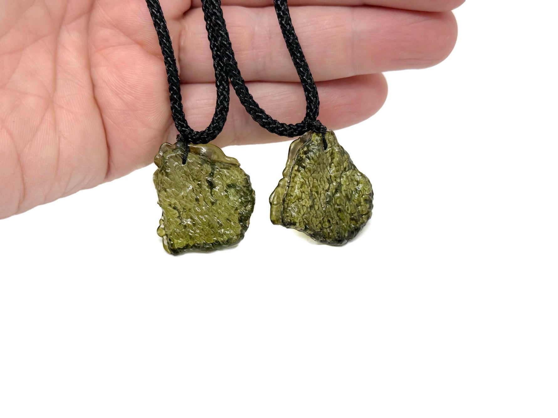 Silver necklace featuring a genuine Moldavite gemstone pendant, perfect for spiritual growth and healing.