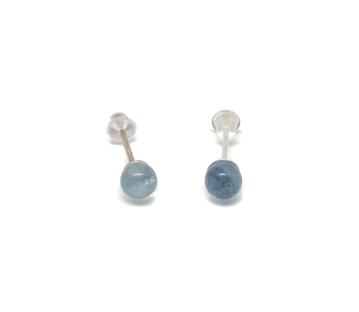 Sterling silver aquamarine stud earrings with crystal accents, featuring a vibrant blue aquamarine gemstone in a simple setting.