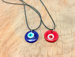 Blue and red glass Evil Eye necklace by GemstoneGO featuring a protective evil eye pendant on a silver chain.