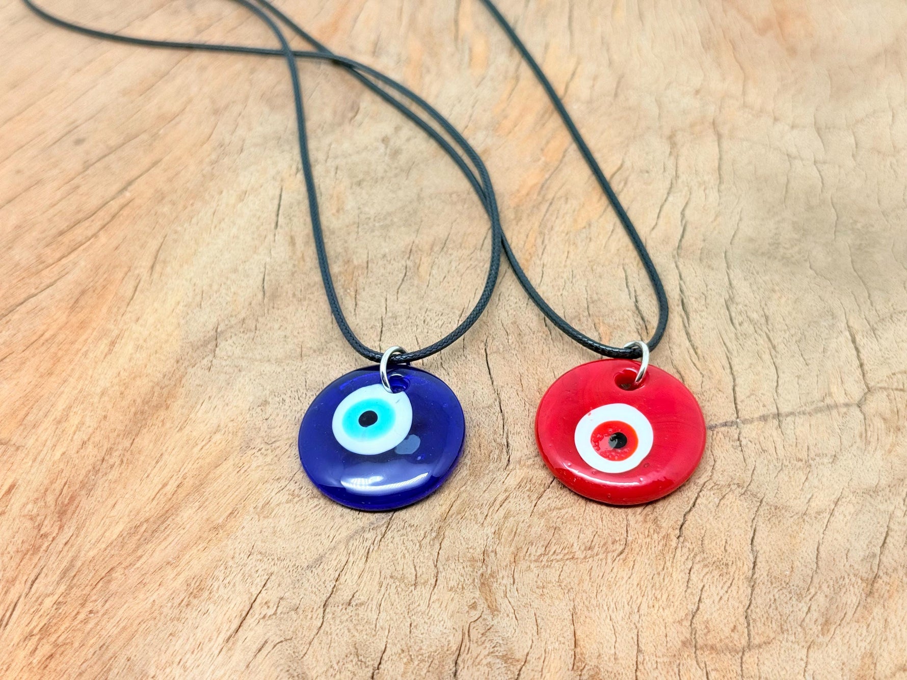 Blue and red glass Evil Eye necklace by GemstoneGO featuring a protective evil eye pendant on a silver chain.