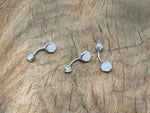 Rose quartz belly button ring with a silver stainless steel navel piercing, featuring a round rose quartz gemstone.