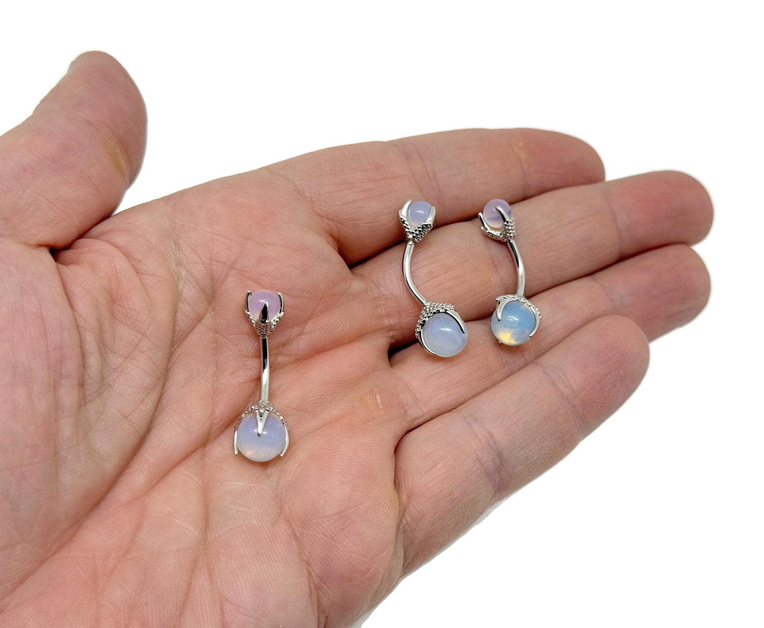 Opalite belly button ring in silver stainless steel with a smooth, oval gemstone, designed for navel piercing.