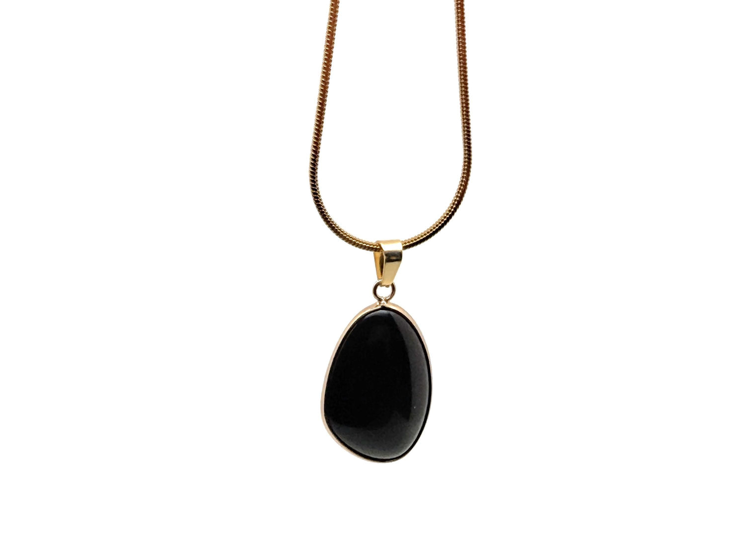 Dainty obsidian gold gemstone pendant with a smooth, polished surface, displayed with jewelry charms from GemstoneGO.