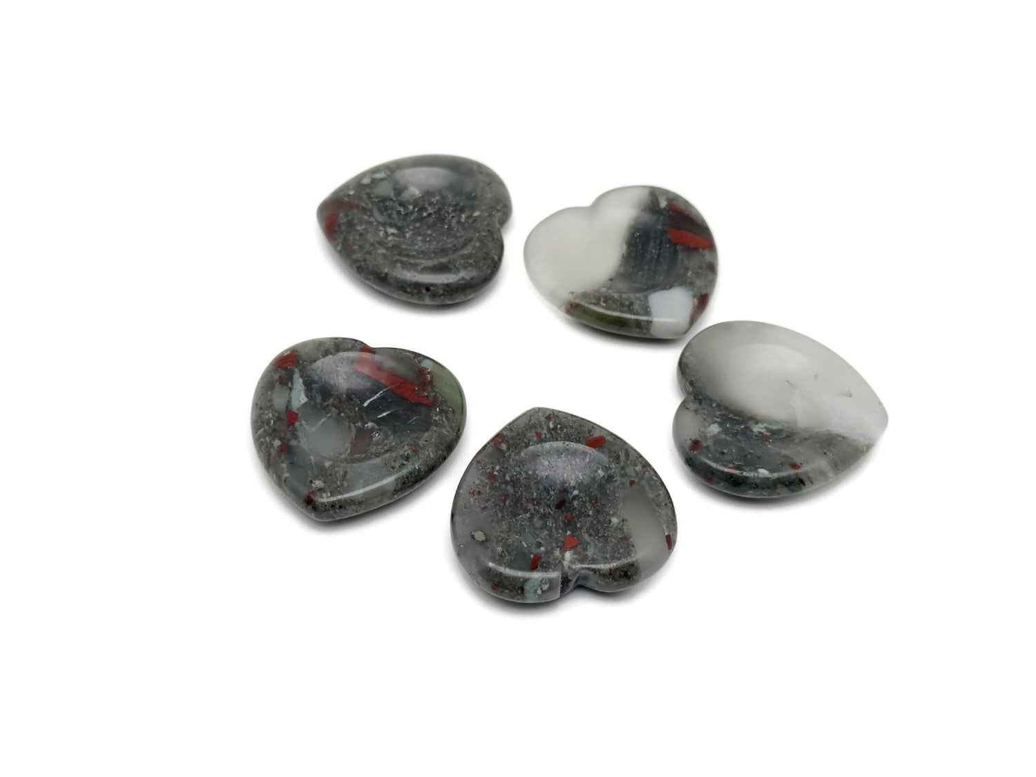 African Bloodstone heart-shaped worry stone from GemstoneGO, featuring soothing dark green and red crystal patterns.