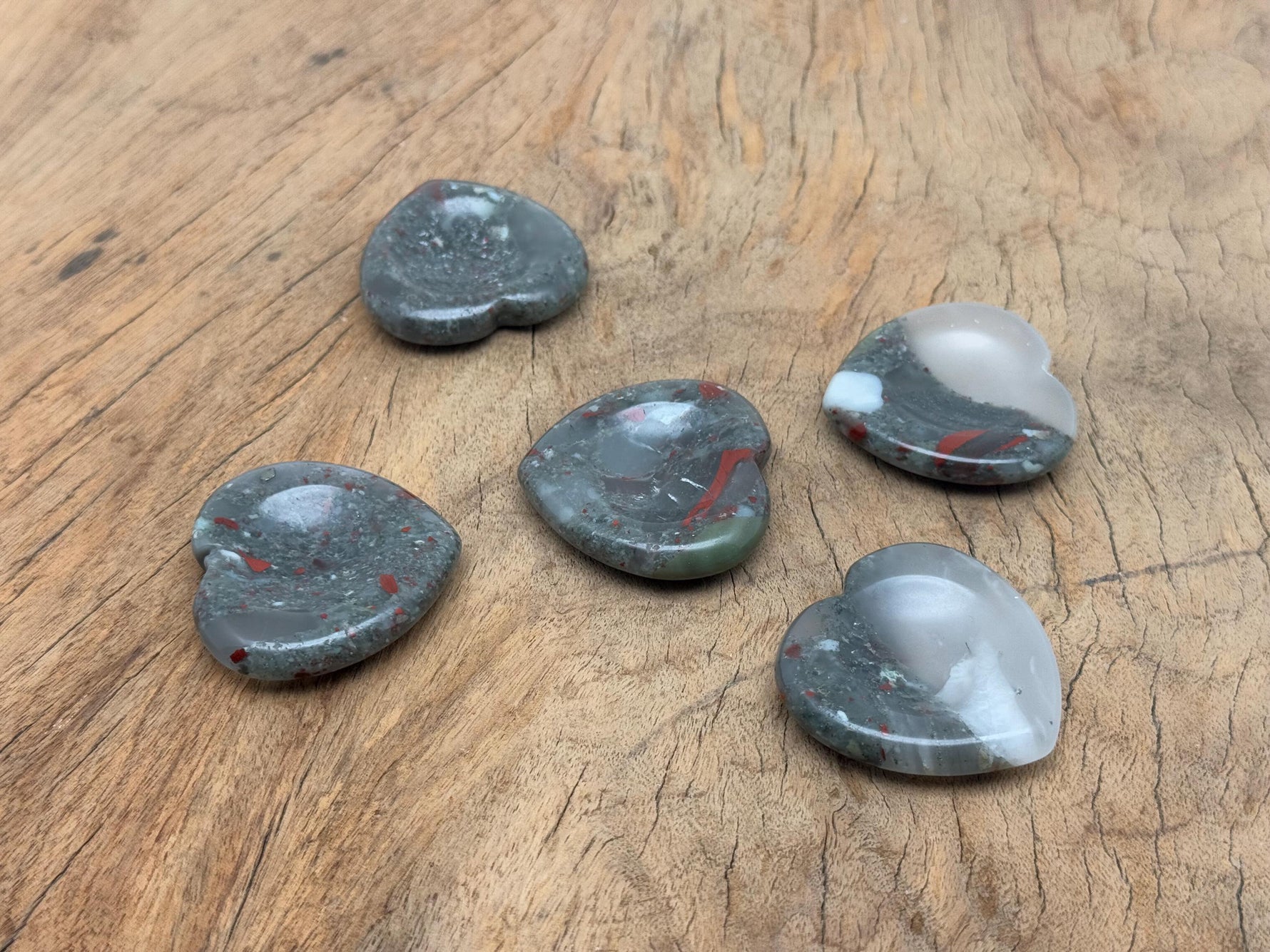African Bloodstone heart worry stone from GemstoneGO, featuring a smooth, polished red and green crystal for stress relief and meditation.