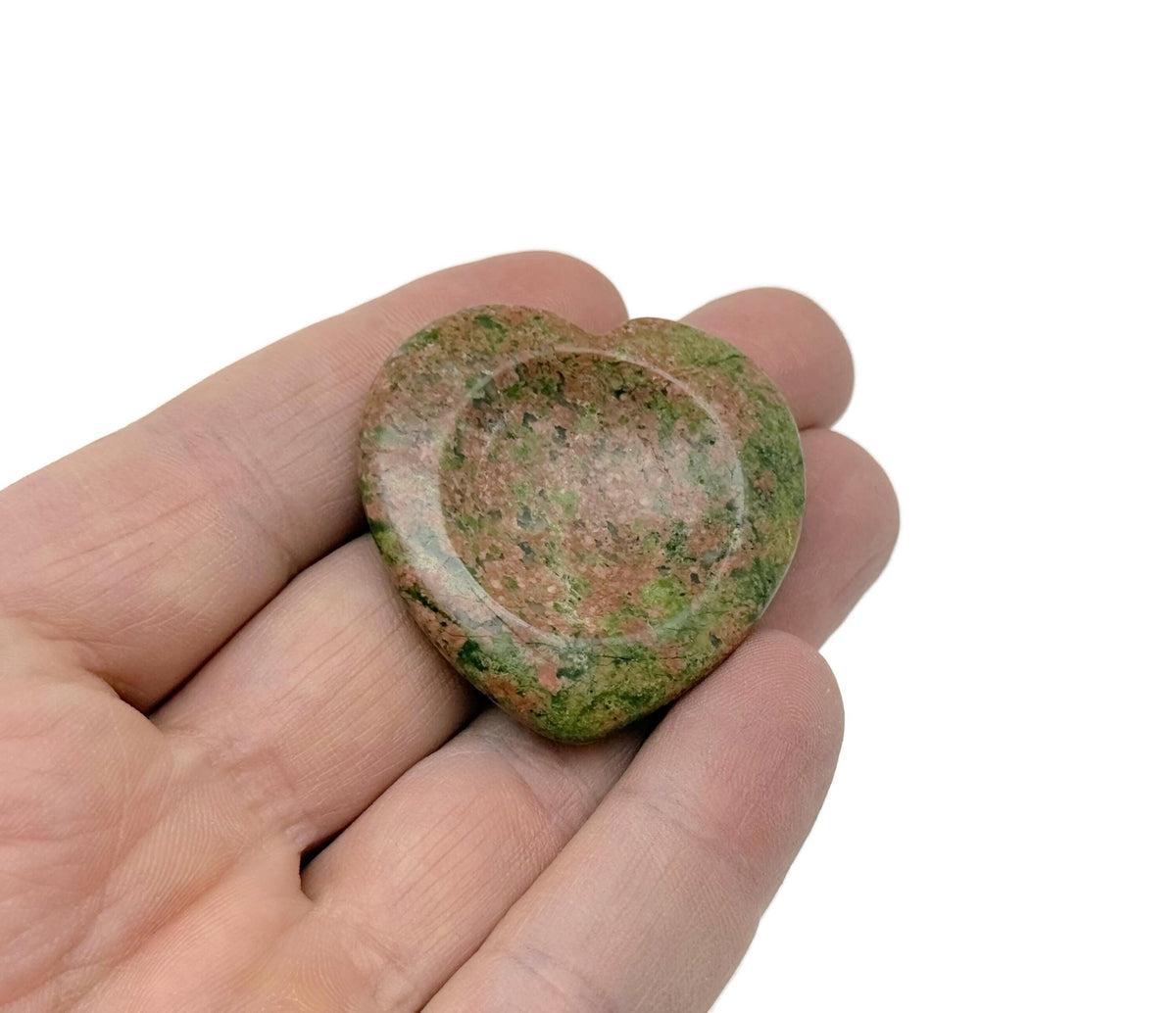 Unakite heart-shaped worry stone from GemstoneGO showing smooth, polished pink and green crystal for soothing energy.
