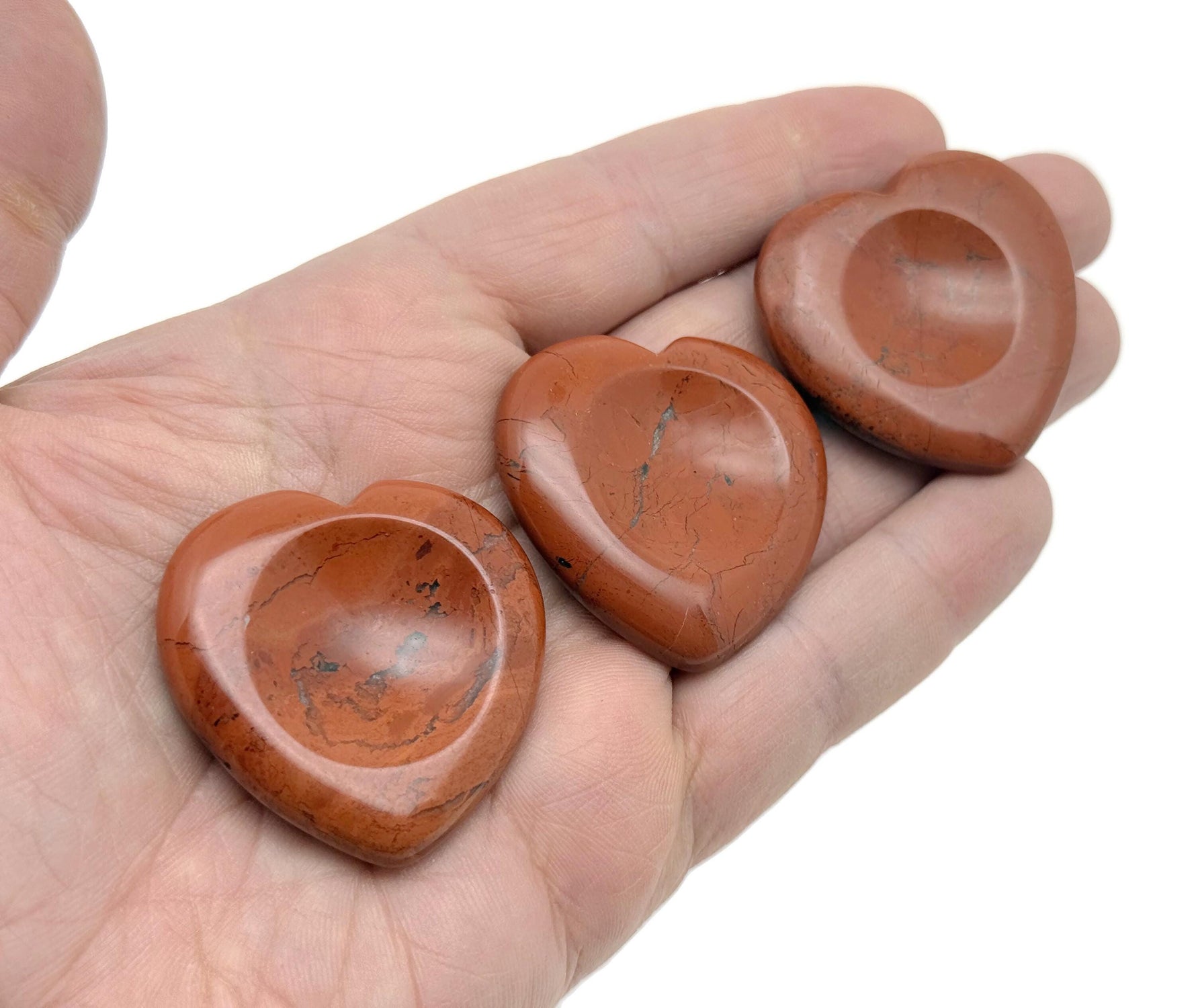 Red Jasper heart worry stone from GemstoneGO, a soothing crystal with polished, heart-shaped design for stress relief and meditation.