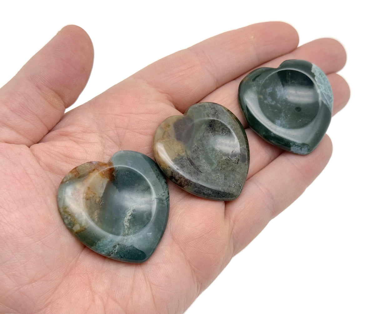Moss agate heart-shaped worry stone from GemstoneGO, featuring calming green and brown crystal patterns, smooth polished surface.