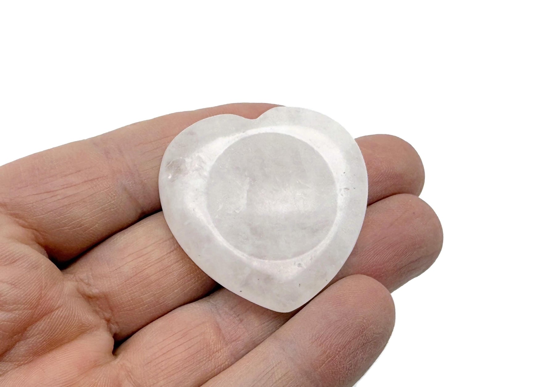 Clear quartz heart worry stone from GemstoneGO, smooth soothing crystal with polished surface for stress relief and meditation.