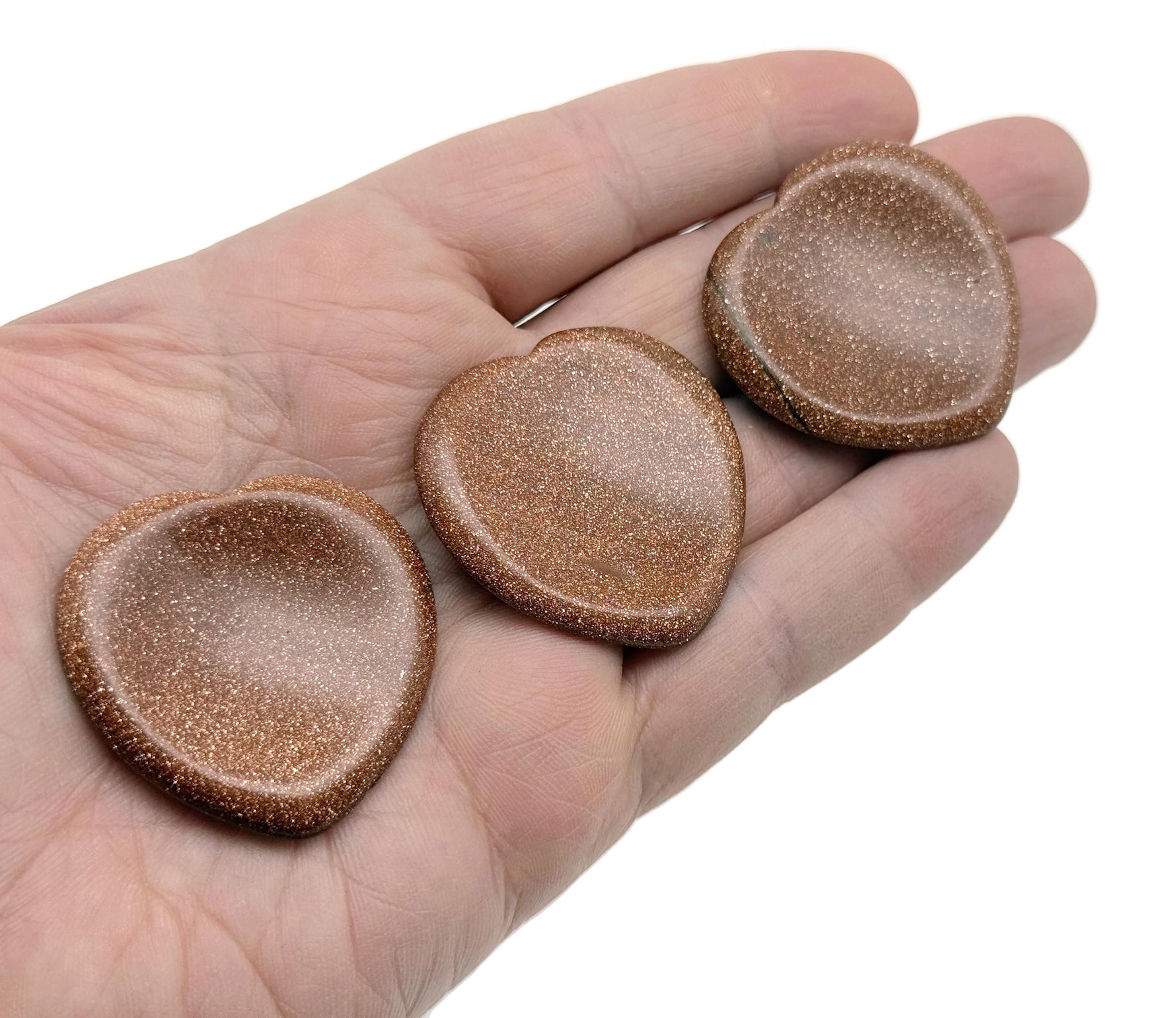 Goldstone heart-shaped worry stone from GemstoneGO, featuring soothing crystal properties and a polished, smooth surface.