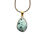 Dainty gemstone pendant from GemstoneGO in gold and silver with a birthstone charm, ideal for jewelry DIY projects.
