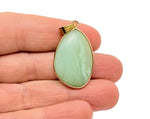 Dainty Amazonite gold gemstone pendant from GemstoneGO, featuring a polished blue-green stone on a delicate gold chain.