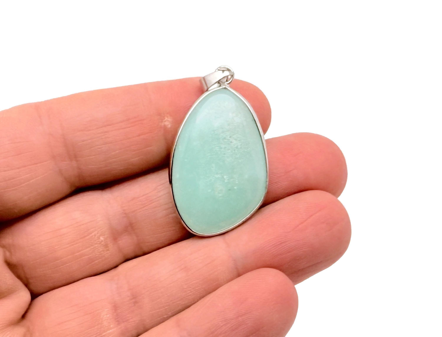 Dainty Amazonite silver gemstone pendant from GemstoneGO, featuring a polished blue-green stone and delicate silver setting.