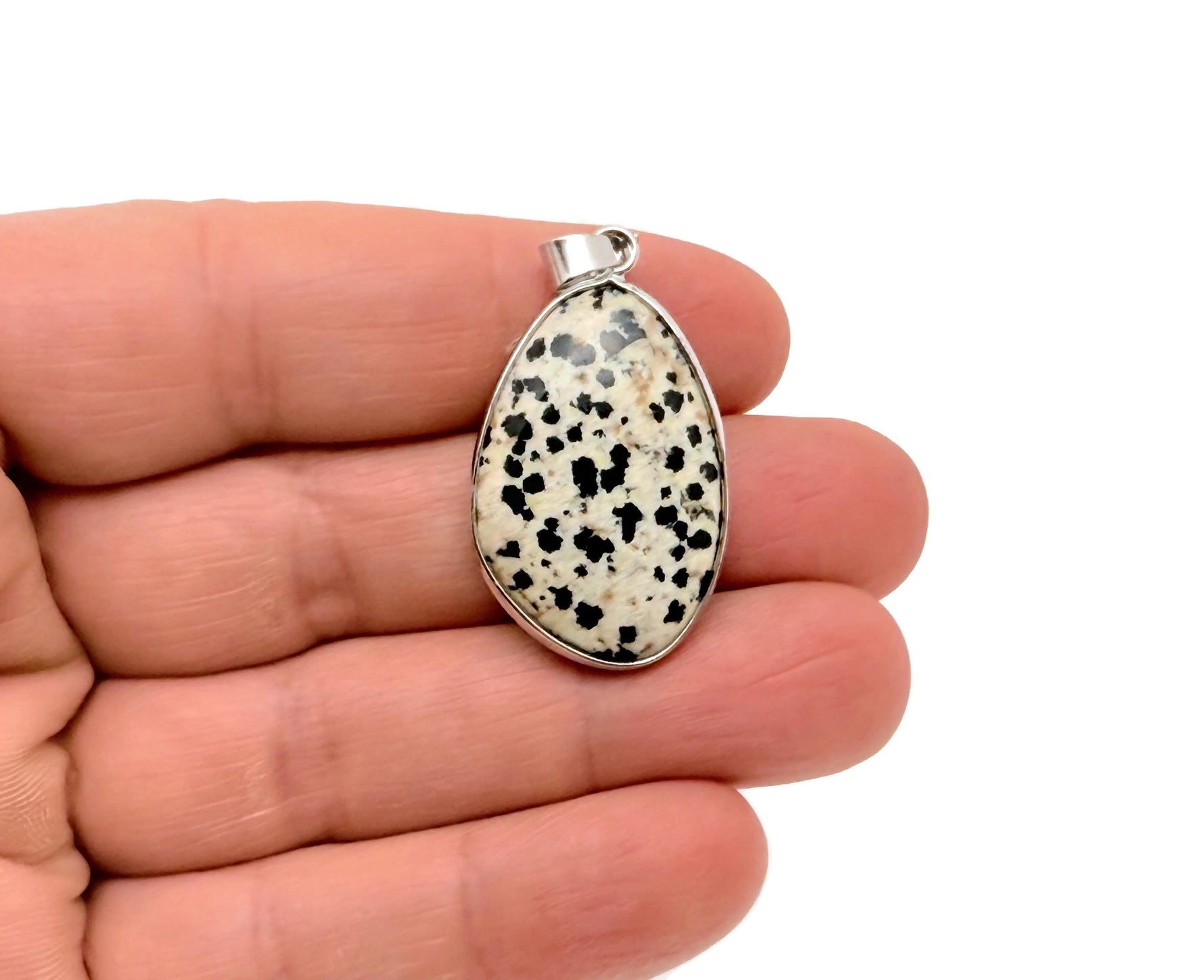 Dalmatian Jasper silver gemstone pendant from GemstoneGO featuring a dainty jewelry charm with black and cream spots.