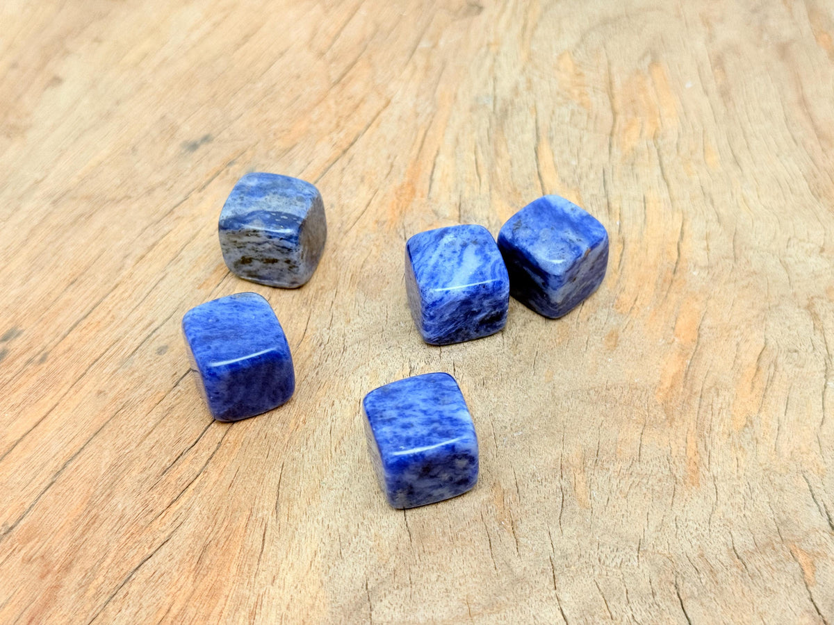 Handmade 16mm Sodalite cube stone with carved details, showcasing deep blue and white mineral patterns from GemstoneGO.