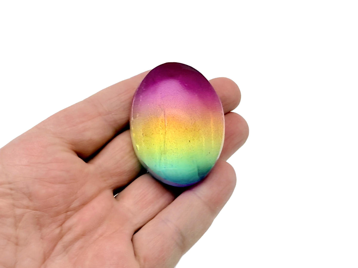 Rainbow Aura Quartz palm gemstone spa stone, 50mm, with vibrant iridescent colors and smooth polished surface from GemstoneGO.