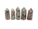 Leopard skin jasper obelisk tower crystal by GemstoneGO, featuring a polished, natural stone with distinctive spotted pattern.