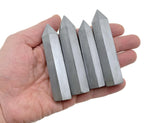 Terahertz Obelisk Tower Crystal by GemstoneGO, featuring a sleek black crystal with a pointed obelisk shape.