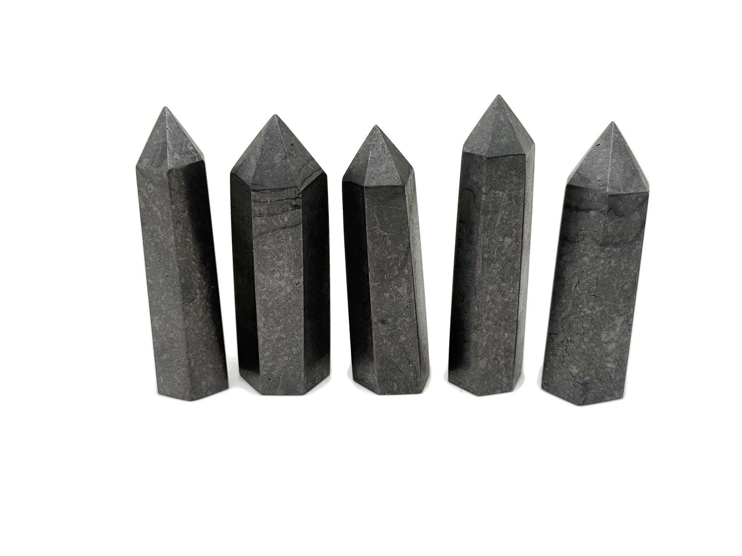 Shungite Obelisk Tower crystal from GemstoneGO featuring a black, polished stone with natural striations and a pointed top.