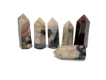 Mookaite Jasper obelisk tower crystal from GemstoneGO showcasing earthy red, yellow, and cream tones with a polished finish.