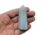 Angelite obelisk tower crystal from GemstoneGO, showing a smooth, pale blue gemstone with natural veining and a pointed top.