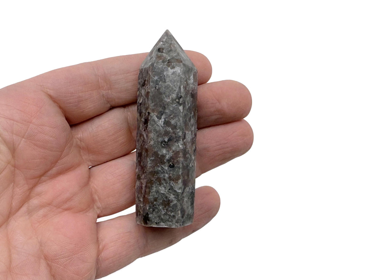 Yooperlite Obelisk Tower crystal featuring fluorescent sodalite stone with vibrant glow under UV light, from GemstoneGO.
